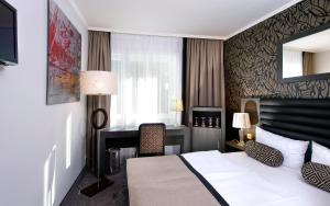 Postel nebo postele na pokoji v ubytování Park Hotel am Berliner Tor