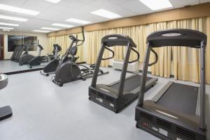 a row of exercise bikes in a gym at Holiday Inn Express Hotel & Suites Minot South, an IHG Hotel in Minot