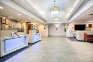 a lobby of a hospital with a waiting room at Holiday Inn Express Hotel & Suites Fort Collins by IHG in Fort Collins