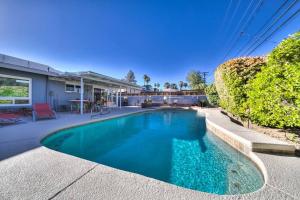 a swimming pool in the backyard of a house at The Downtown Vintage Gem in Las Vegas