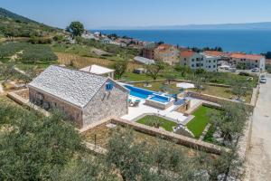an aerial view of a house with a swimming pool at Villa Blue Sky in Bol