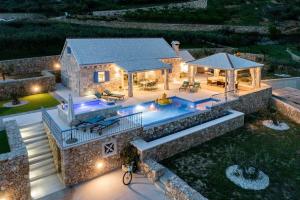 an aerial view of a house with a swimming pool at Villa Blue Sky in Bol