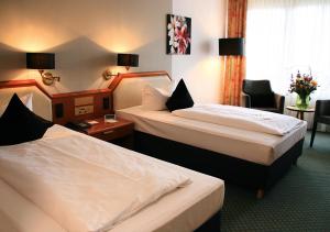 
Ein Bett oder Betten in einem Zimmer der Unterkunft AVIA Hotel
