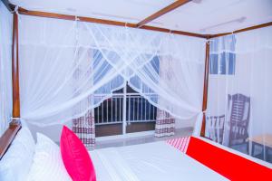 Llit o llits en una habitació de Onaro Beach View