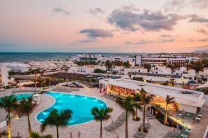 an aerial view of a resort with a swimming pool at Hotel Lava Beach in Puerto del Carmen