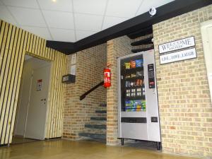 a fire hydrant next to a brick wall at Ambassador Suites Leuven in Leuven