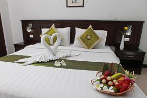 Postel nebo postele na pokoji v ubytování First Residence Hotel