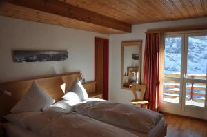 Postel nebo postele na pokoji v ubytování Hotel Edelweiss Superior