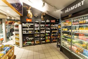 a supermarket aisle with products on display at Åkrafjordtunet Åkrafjordvegen 1105 in Teigland