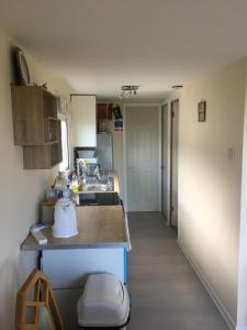 a kitchen with a sink and a counter top at Milas Place in Leysdown-on-Sea