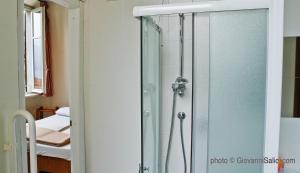 A bed or beds in a room at SANTANGELA Hostel & Rooms