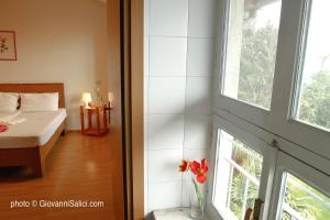 A bed or beds in a room at SANTANGELA Hostel & Rooms