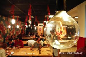 a light bulb with a shrimp in it in a restaurant at Lake Como Peace Lodge - Casa della Pace in Menaggio