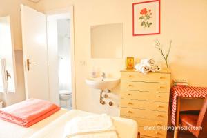 A bed or beds in a room at SANTANGELA Hostel & Rooms