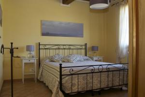 Tempat tidur dalam kamar di La Fonte al Prete