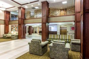 a lobby with couches and chairs in a building at La Quinta by Wyndham Milwaukee Bayshore Area in Glendale