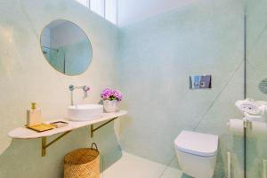 a bathroom with a sink and a mirror at INCREDIBLE DUPLEX PENTHOUSE & TERRACES & Parking in Porto