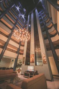 TV a/nebo společenská místnost v ubytování Hotel Saint Louis