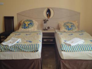 Ліжко або ліжка в номері Hotel Faraon