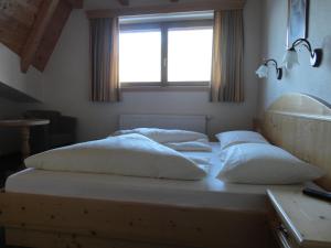 Voodi või voodid majutusasutuse Hotel Garni Klocker toas
