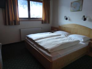Voodi või voodid majutusasutuse Hotel Garni Klocker toas