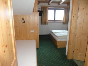 Voodi või voodid majutusasutuse Hotel Garni Klocker toas