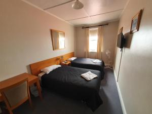 The Victoria Hotel客房内的一张或多张床位