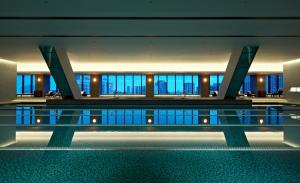 a building with a pool in the middle of it at The Okura Tokyo in Tokyo