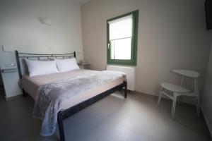 Posteľ alebo postele v izbe v ubytovaní Pelican Hotel