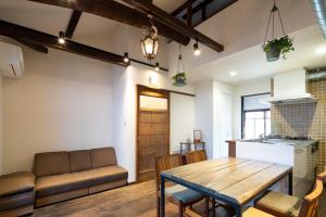 a living room with a table and a couch at JISHO-AN in Kyoto