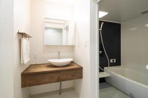 a bathroom with a sink and a bath tub at JISHO-AN in Kyoto +57 photos
