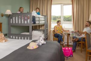 a group of people sitting in a hotel room at Celtic Ross Hotel & Leisure Centre in Rosscarbery