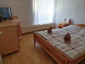 Posteľ alebo postele v izbe v ubytovaní Főnix Panzió
