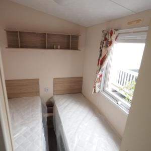 Postel nebo postele na pokoji v ubytování Camping De Binnenvaart Superior Chalet