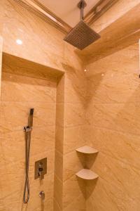 a bathroom with a shower with a shower head at AC Residence - Behind Cititel Hotel in Kota Kinabalu