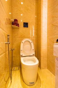 a small bathroom with a toilet in a room at AC Residence - Behind Cititel Hotel in Kota Kinabalu