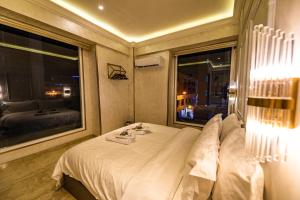 a hotel room with a bed and a large window at AC Residence - Behind Cititel Hotel in Kota Kinabalu