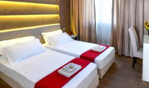 Voodi või voodid majutusasutuse Hotel Bora Bora velipoja toas