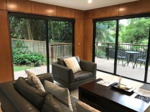 a living room with a couch and a table at Springbrook25 Pet friendly House in Springbrook