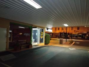 an outside view of a building with a ceiling at Inverell Motel in Inverell