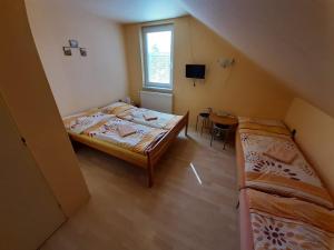 Posteľ alebo postele v izbe v ubytovaní Penzion a Chatový Camp Havraníky u NP Podyjí