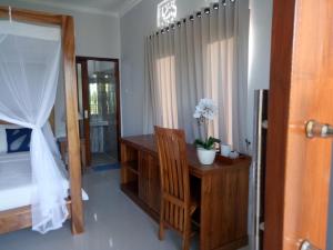 Postel nebo postele na pokoji v ubytování Suryadina Guest House