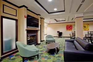 A television and/or entertainment centre at Holiday Inn Express Hotel Raleigh Southwest, an IHG Hotel