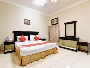 Krevet ili kreveti u jedinici u objektu رونزا للوحدات السكنية المفروشة Rwnza Hotel Apartments