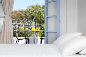 Postel nebo postele na pokoji v ubytování Areti Hotel
