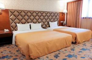 Postel nebo postele na pokoji v ubytování Chyuan Du Spring Resort