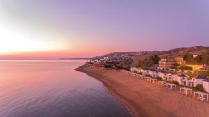 an aerial view of a beach at sunset at Arìa Residenze d'aMare in Crotone