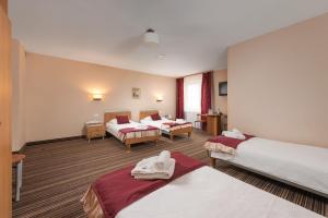 Voodi või voodid majutusasutuse Hotel Partner toas