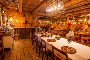 a dining room with a table and chairs in a kitchen at Hesla Farm in Gol