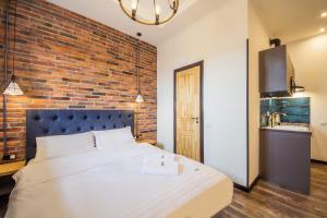 Postel nebo postele na pokoji v ubytování Secret Apartments